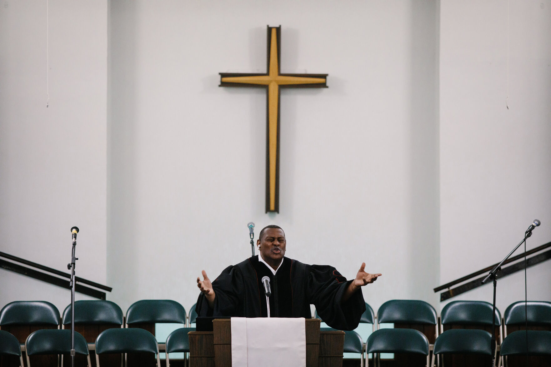 Rev. Rodrick Williams Sr. outstretches his arms